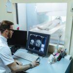 male-radiologist-analyzing-mri-scan-results-patient-computer-monitor-control-room-4-min